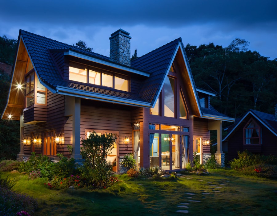 Warmly-lit family home at twilight with peaked roof and stone chimney, representing well-protected coverage